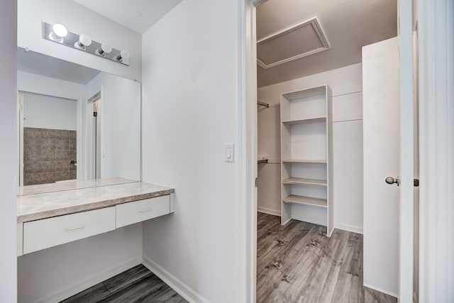 bathroom with hardwood / wood-style flooring and vanity