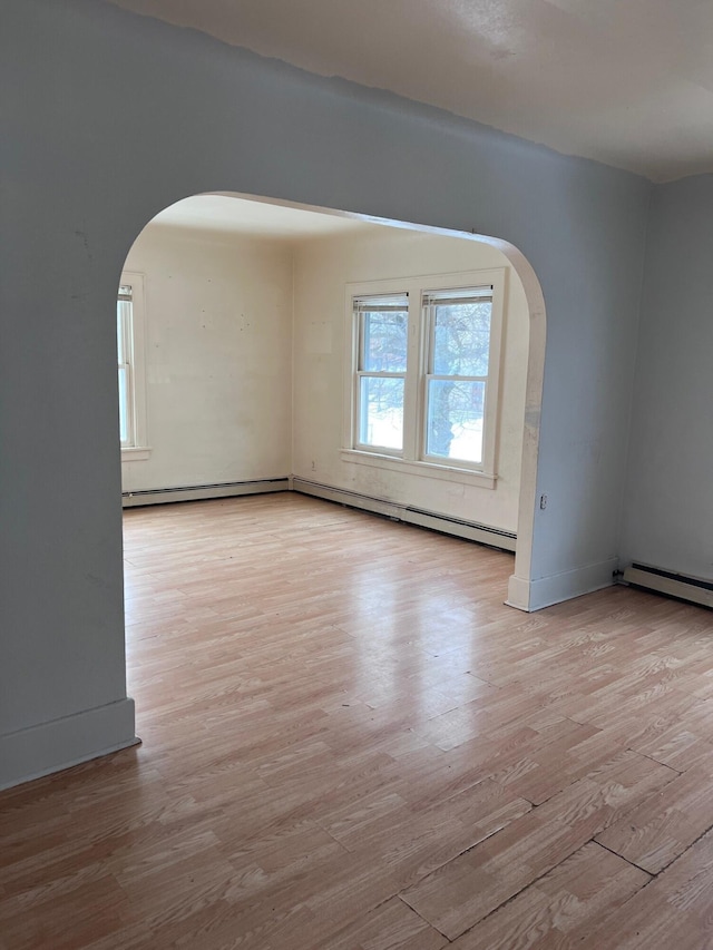 spare room with light hardwood / wood-style flooring