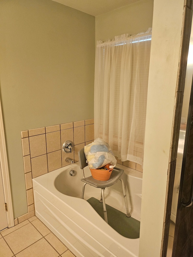 bathroom featuring tile patterned floors and a bathtub