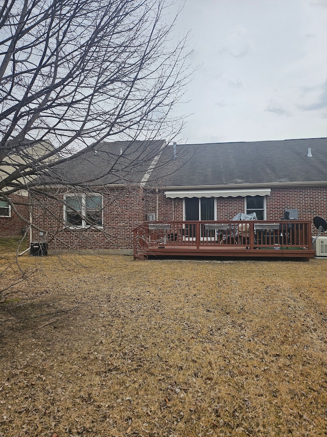 back of house featuring a deck