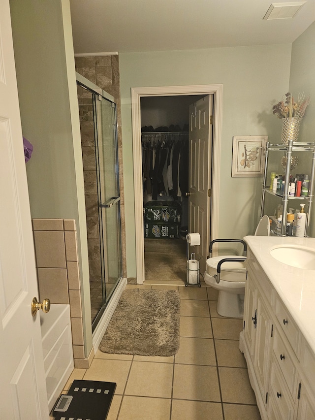 full bathroom with toilet, vanity, tile patterned flooring, and independent shower and bath