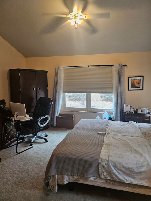 carpeted bedroom featuring ceiling fan and vaulted ceiling