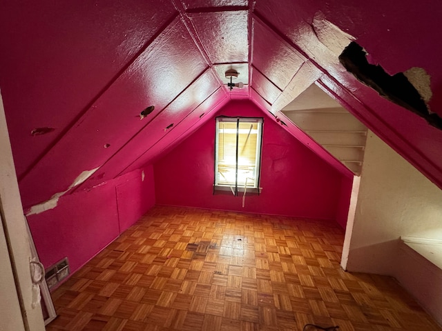 additional living space featuring vaulted ceiling