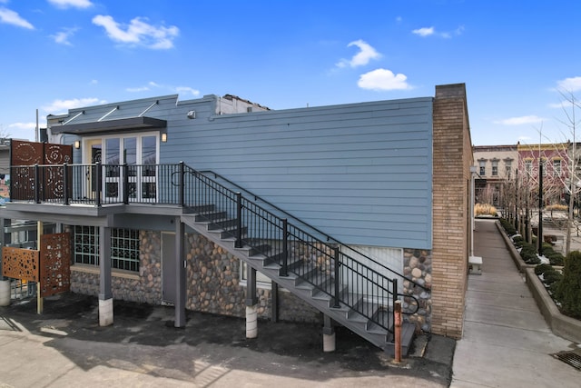 exterior space featuring a chimney and stairway