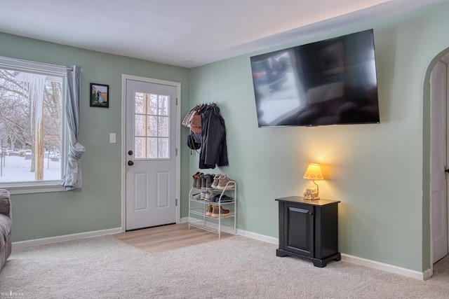 entryway with light carpet