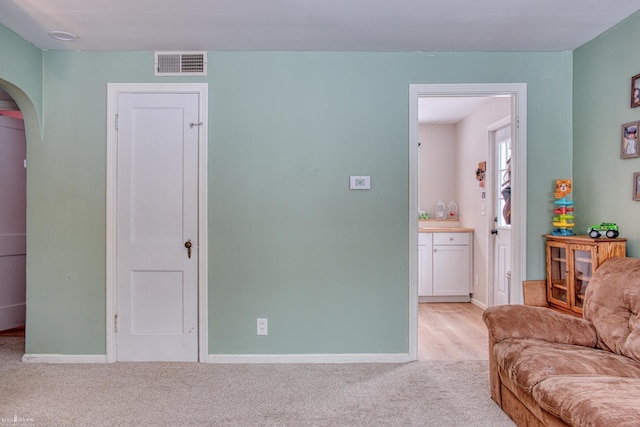 living room with light colored carpet