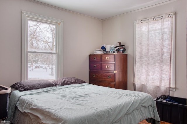 bedroom with ornamental molding