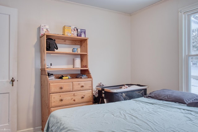 bedroom with ornamental molding