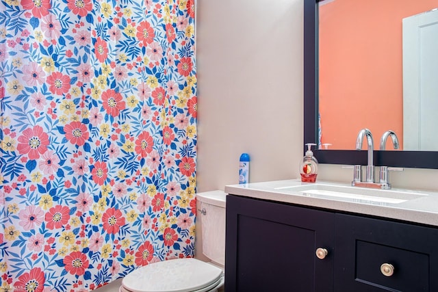 bathroom with vanity and toilet