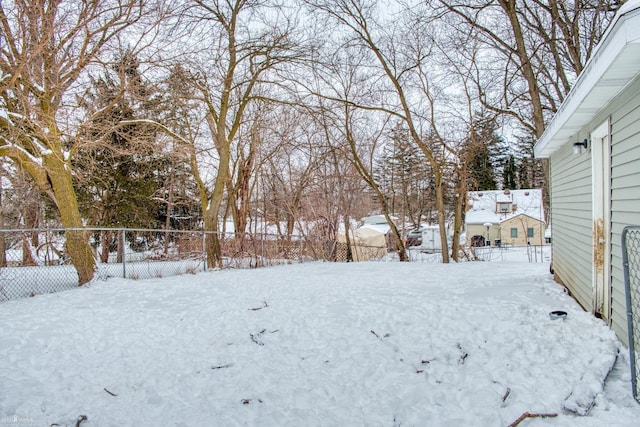 view of yard layered in snow