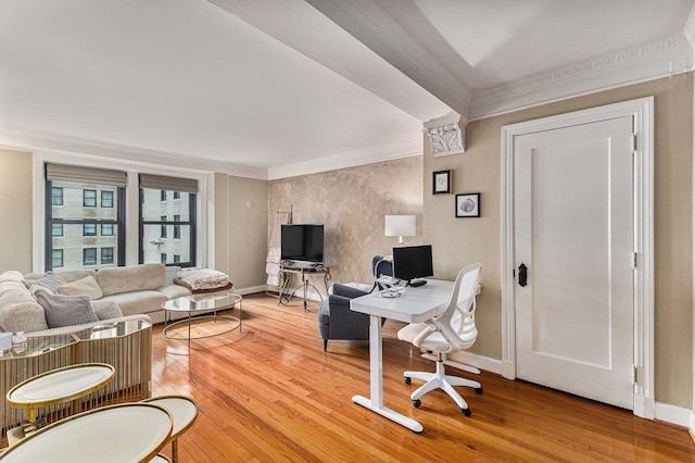 office featuring baseboards, light wood-style floors, and ornamental molding