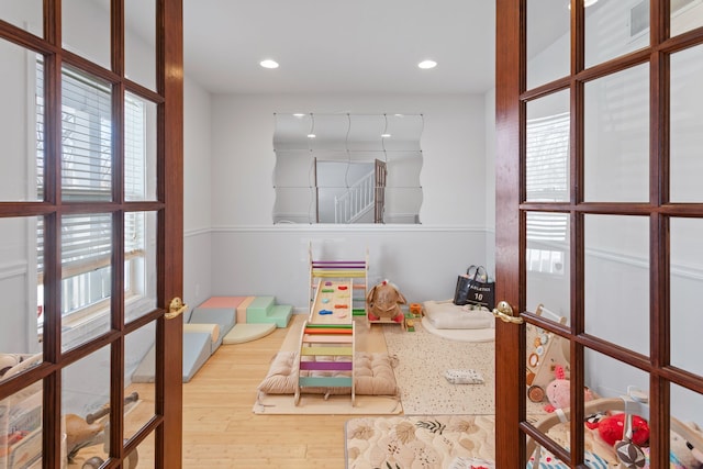 game room featuring hardwood / wood-style floors