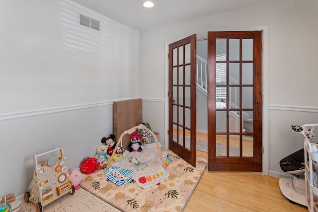 recreation room featuring hardwood / wood-style floors