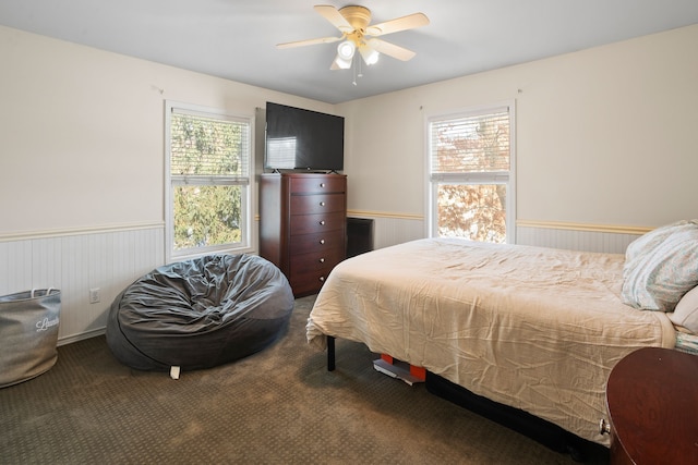 bedroom with ceiling fan and carpet flooring