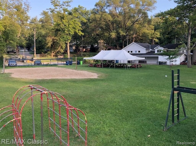 exterior space featuring a yard and volleyball court