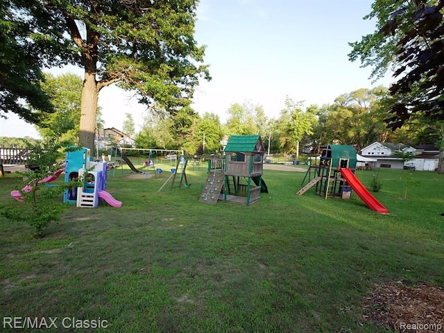 view of playground with a lawn