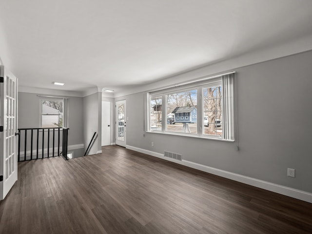 empty room featuring dark hardwood / wood-style flooring