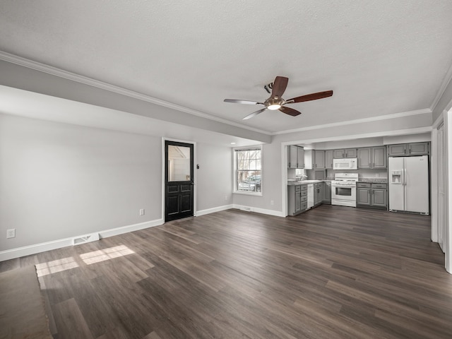 unfurnished living room featuring ornamental molding, dark wood-type flooring, a textured ceiling, and ceiling fan