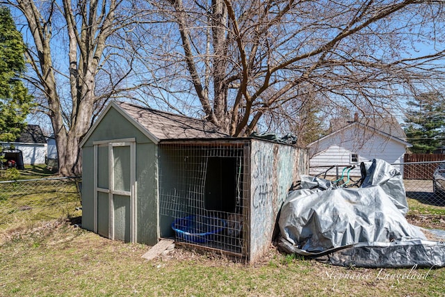 view of outbuilding with an outdoor structure and fence
