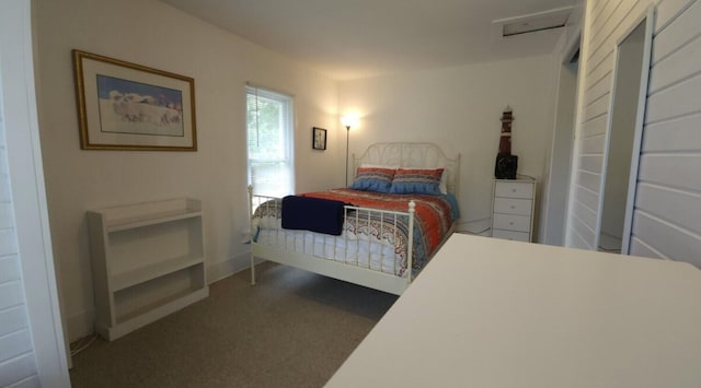 bedroom featuring dark carpet