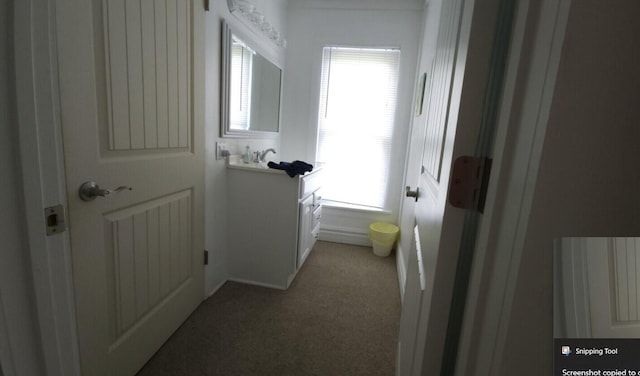 corridor with carpet floors