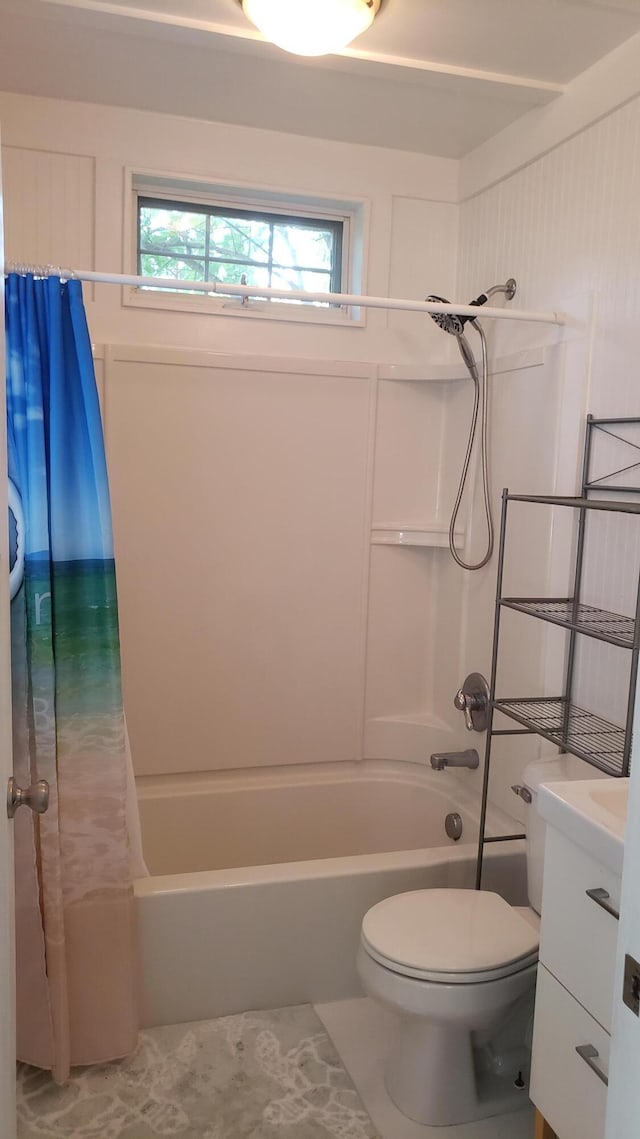 full bathroom with vanity, shower / tub combo, and toilet