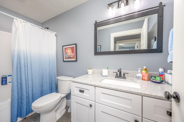 bathroom with vanity, toilet, and tile patterned flooring