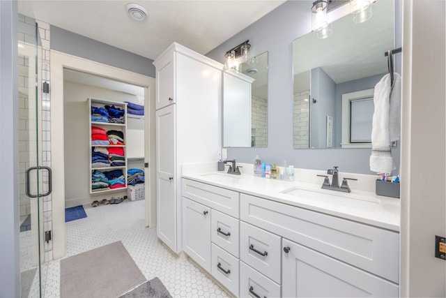 bathroom featuring vanity and a shower with shower door