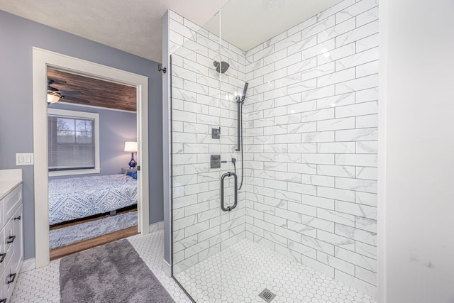 bathroom featuring vanity, an enclosed shower, and tile patterned floors