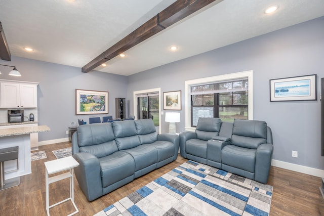 living room featuring dark hardwood / wood-style flooring and beamed ceiling