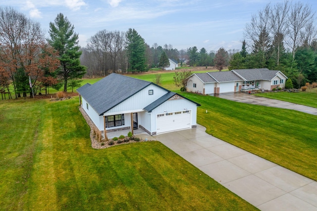 view of front of home featuring a garage and a front yard