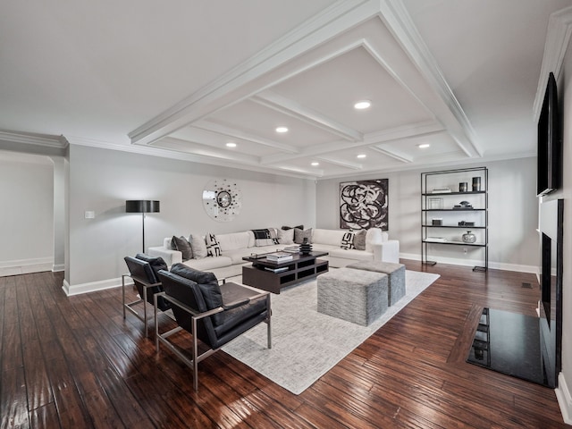 living room featuring dark wood-style floors, ornamental molding, a fireplace, and baseboards