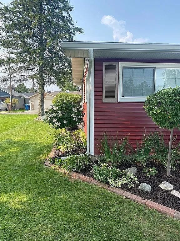 view of property exterior with a yard