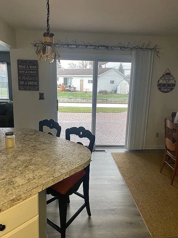 dining space featuring hardwood / wood-style flooring