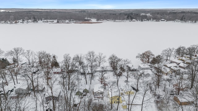 snowy aerial view with a residential view