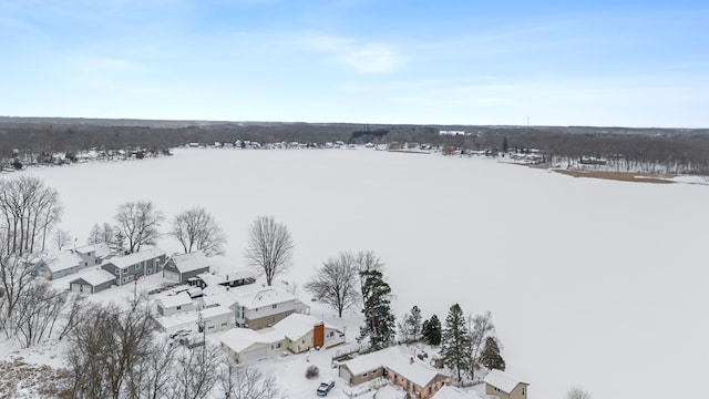 snowy aerial view with a residential view