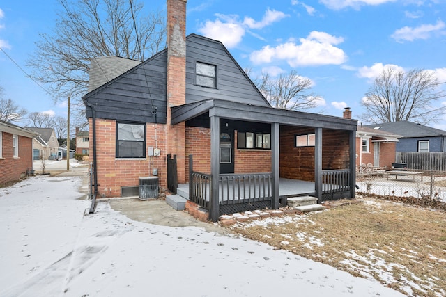 bungalow-style house featuring central AC and covered porch