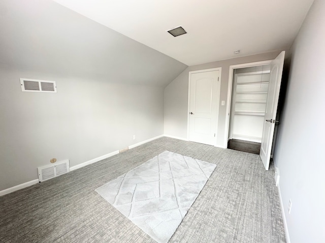 bonus room featuring carpet and vaulted ceiling