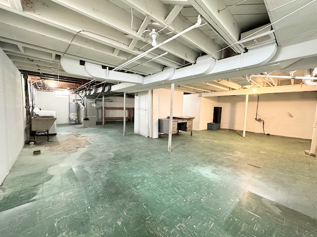 basement with sink and gas water heater