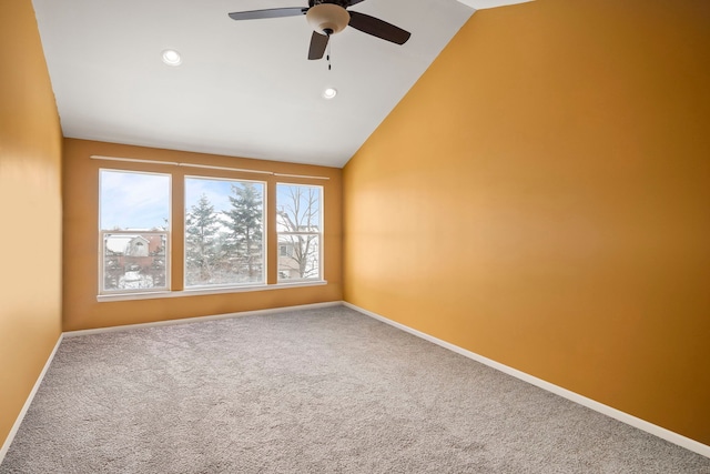 carpeted spare room featuring high vaulted ceiling, recessed lighting, ceiling fan, and baseboards