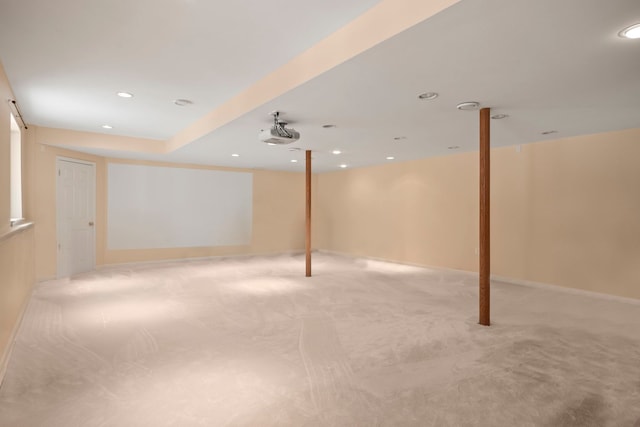 finished below grade area featuring recessed lighting and light colored carpet