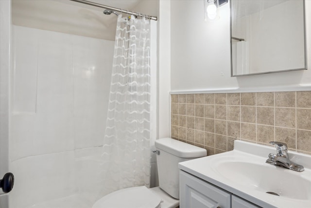 bathroom featuring a shower with shower curtain, toilet, tile walls, and vanity