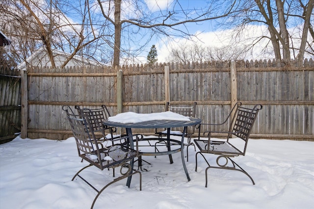 exterior space with outdoor dining space and a fenced backyard