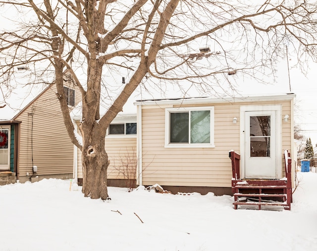 view of snow covered house