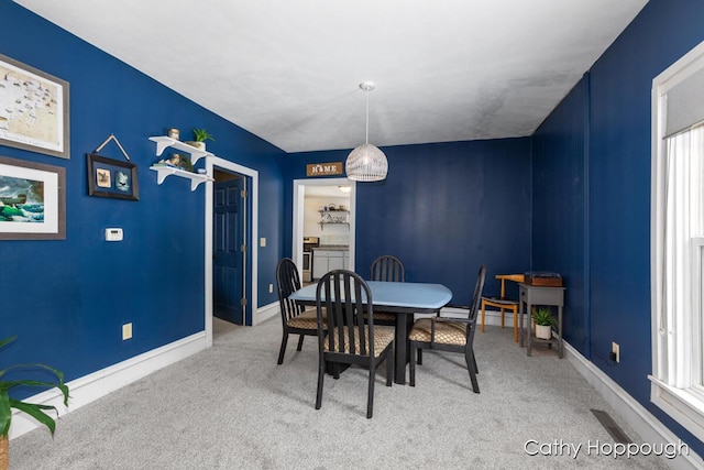 view of carpeted dining space