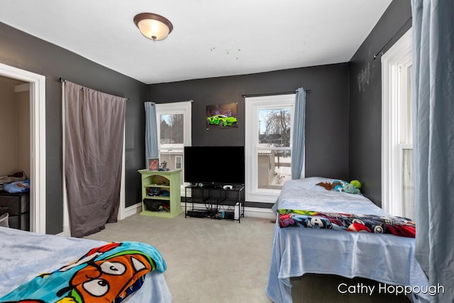 bedroom featuring light carpet