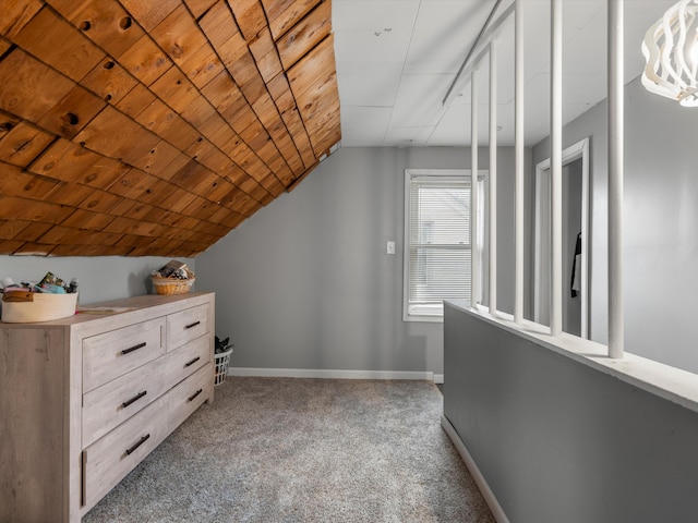 bonus room with wood ceiling, lofted ceiling, and carpet flooring