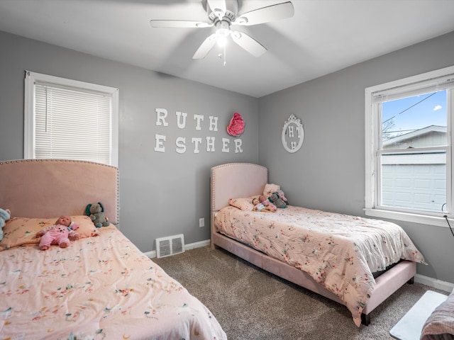 bedroom featuring ceiling fan and carpet