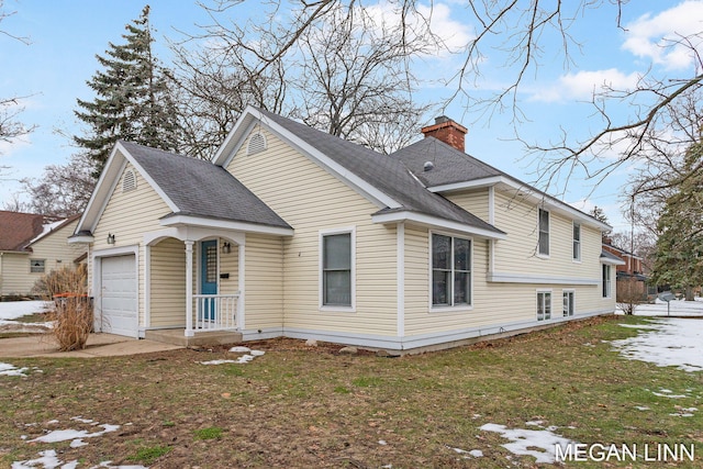 exterior space with a garage and a front lawn