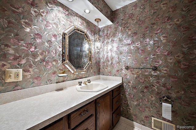 385 Joslyn Rd, Lake Orion, MI 48362 - bathroom with wallpapered walls, vanity, and tile patterned floors